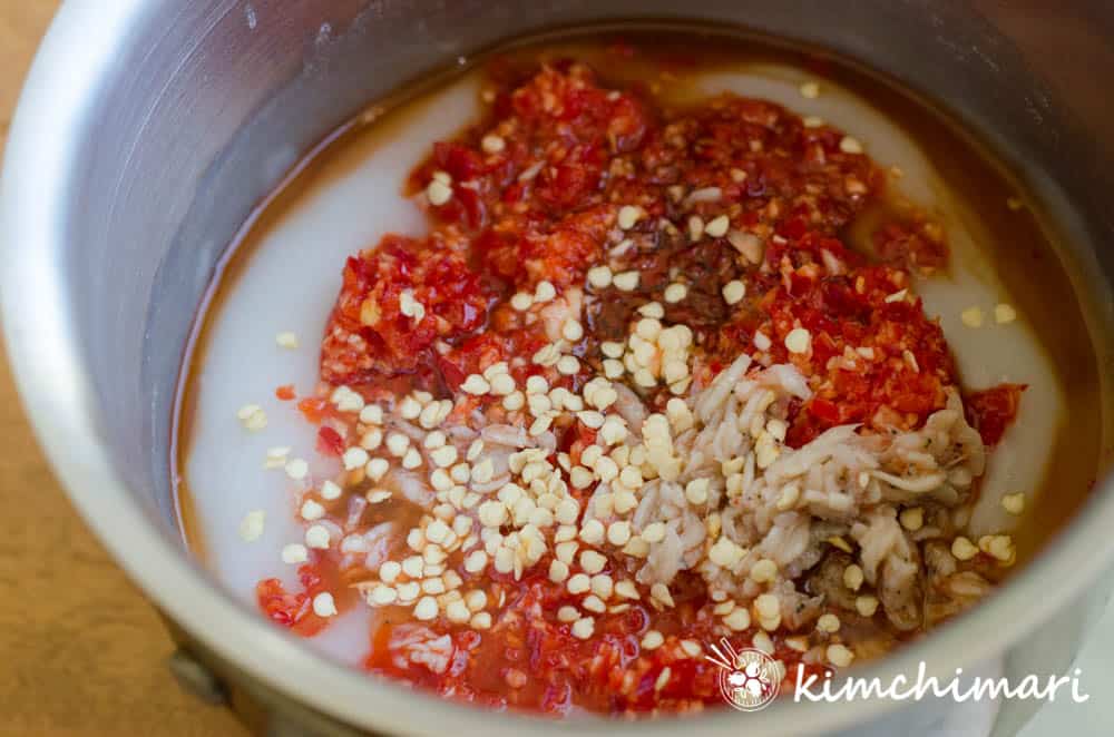 kimchi seasoning added to flour paste in pot