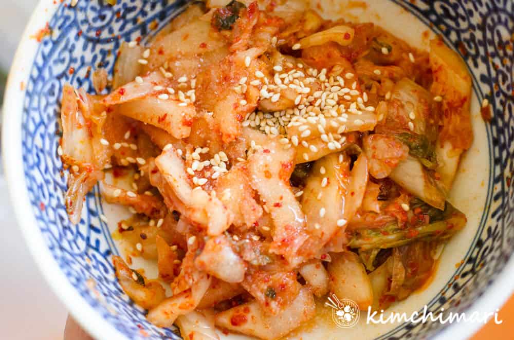 seasoning cut kimchi for topping on Cold Kimchi Noodle soup