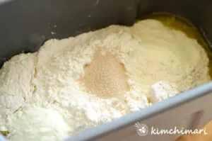 dry ingredients with yeast in the center in bread pan