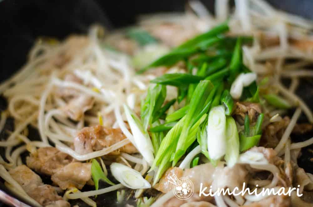 green onions added to samgyeopsal sukju bokkeum in pan