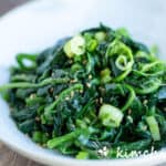 korean spinach side dish in white dish