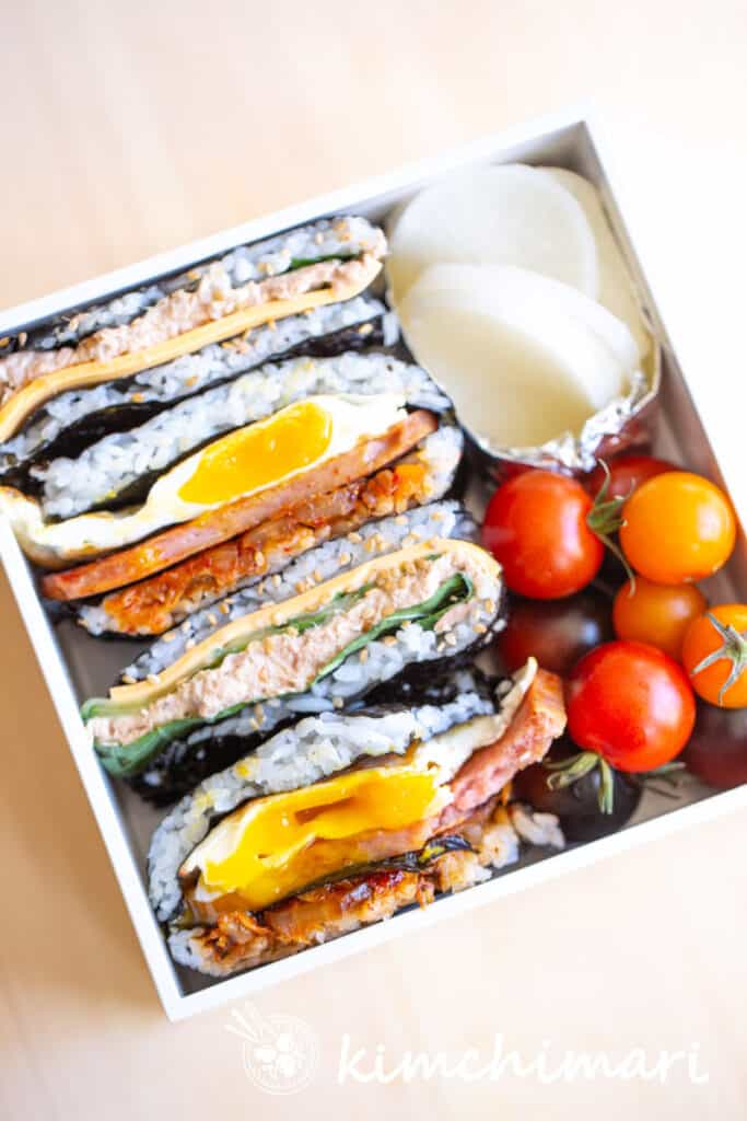 folded kimbap sandwiches in lunch box