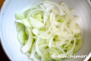 cucumber and onion pickling in bowl