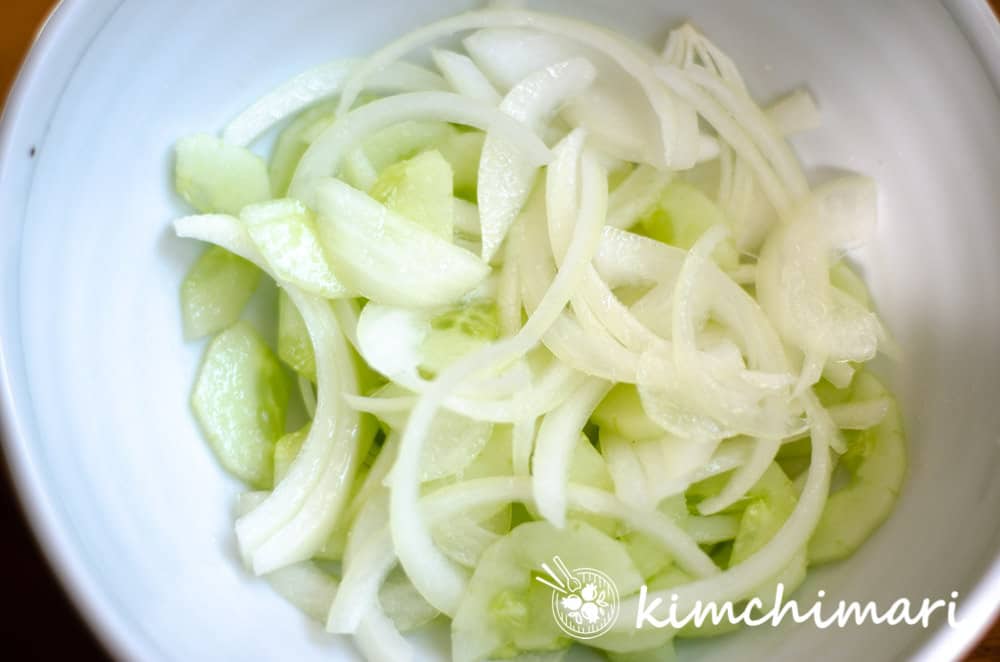 cucumber and onion pickling in bowl