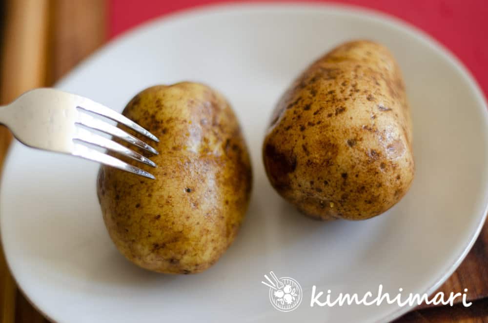 piercing cooked potatoes with skin on 