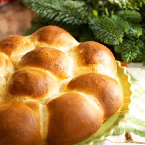 milk bread rolls baked in pie pan with christmas decor in background