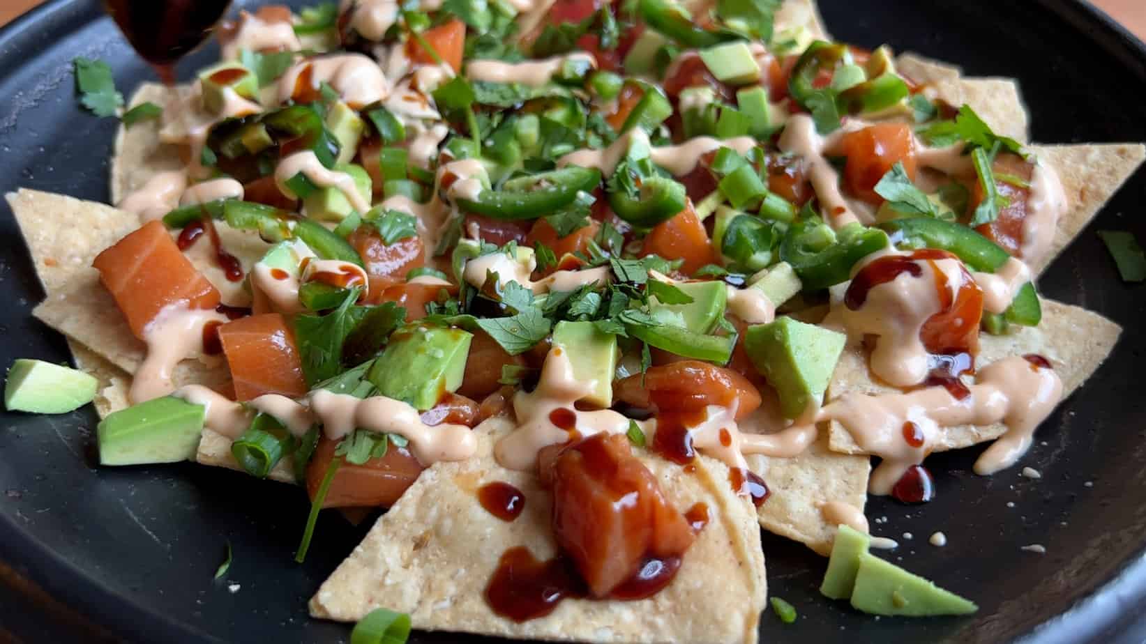 poke nachos finished with toppings
