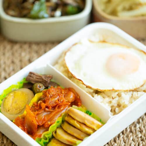 Korean Lunchbox Dosirak with rice, jangjorim, kimchi and sausage