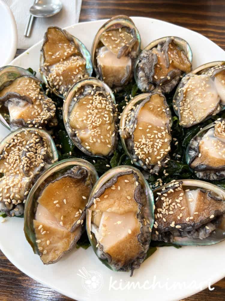 plate of raw abalone in shells