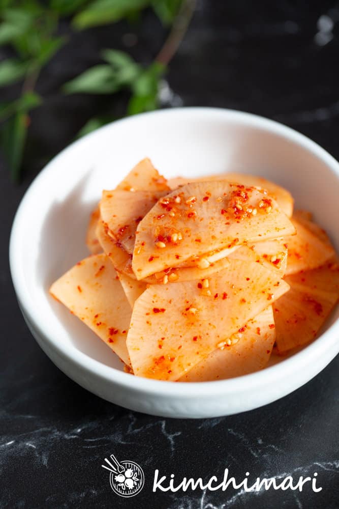 radish kimchi muchim in white bowl