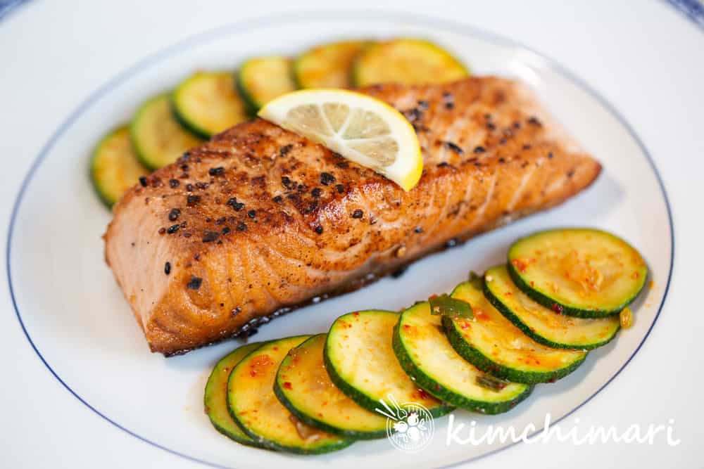 cooked salmon and zucchini on plate