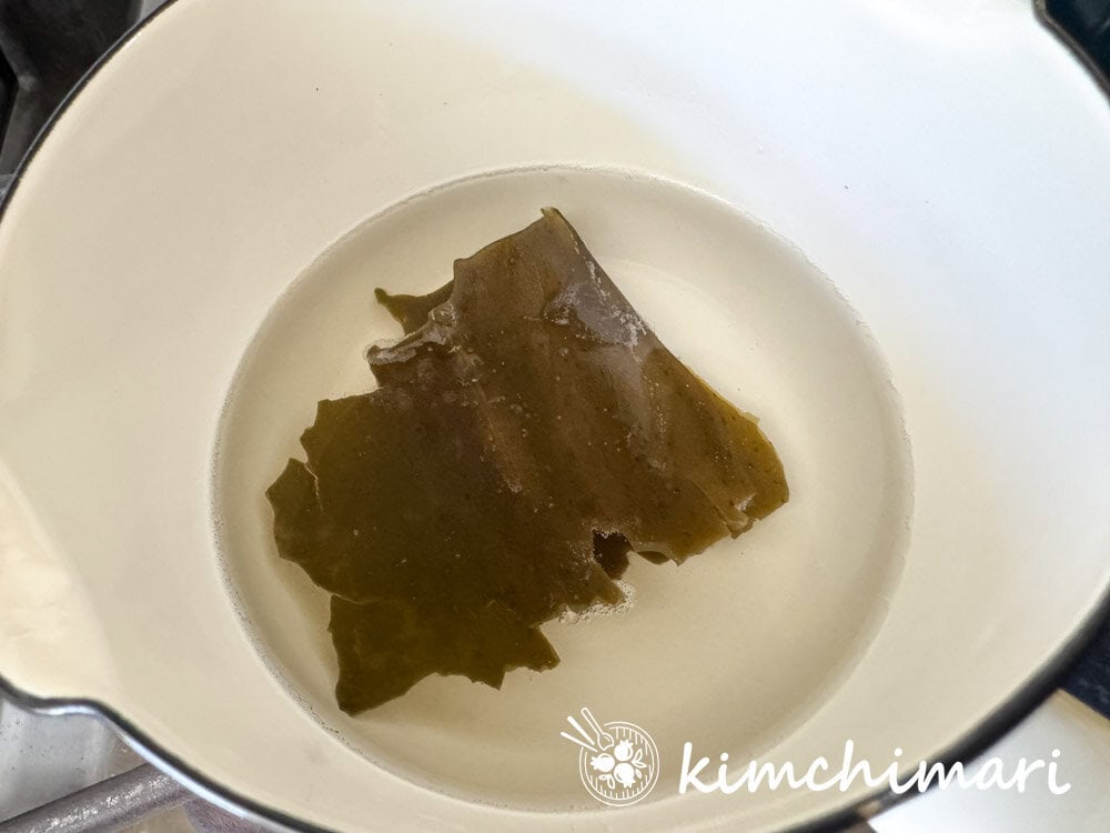 dried kombu kelp in water in pot